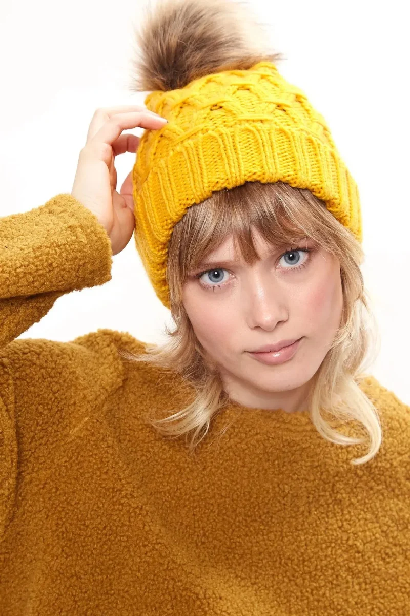 cozy shauna cable knit beanie with faux fur bobble mustard