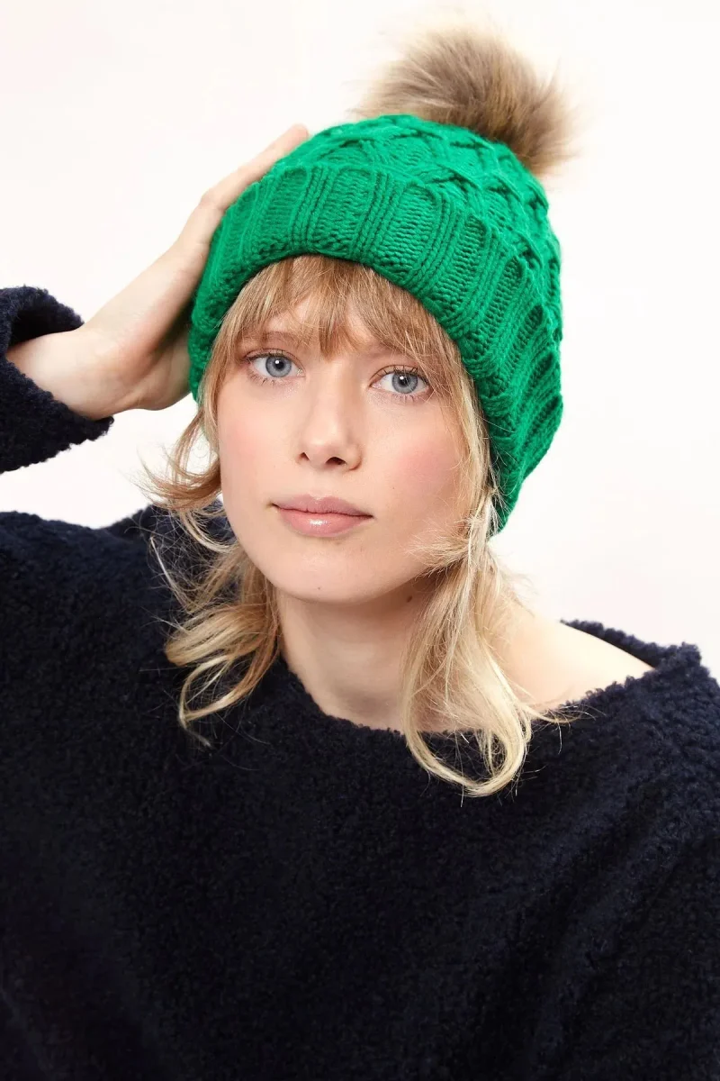 green cable knit beanie with faux fur bobble louche shauna