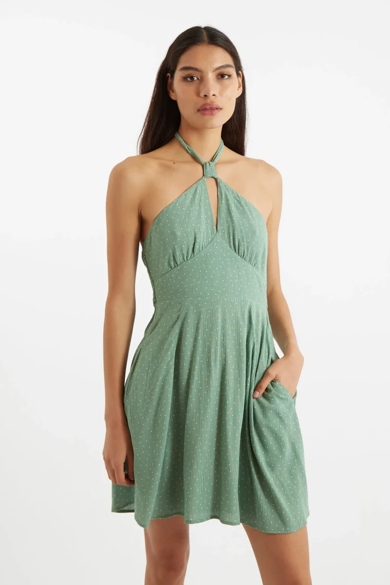 green halter neck mini dress with petite dot print scaled